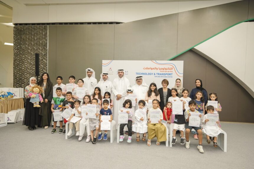 Officials and children during a visit to a metro station.